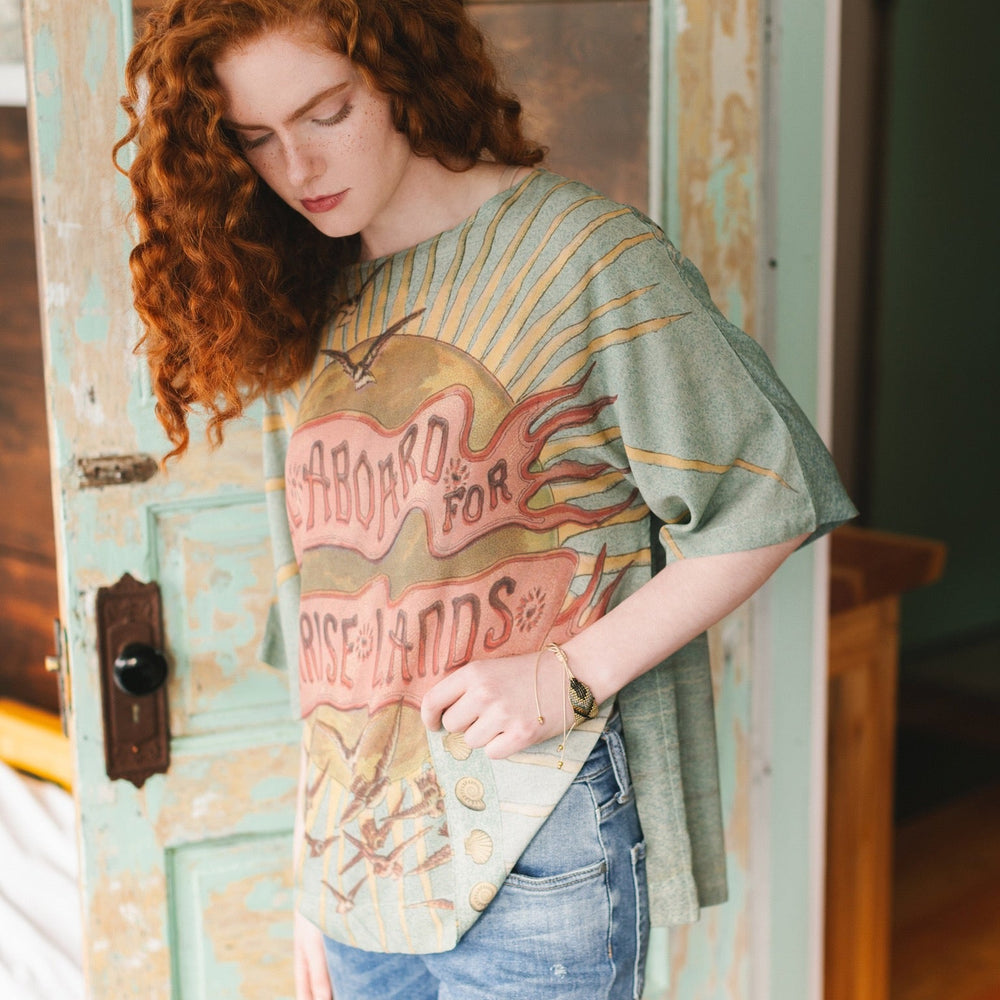
                  
                    Soft bamboo-based tee featuring antique nautical artwork with shells, sunshine, and mermaid – Market of Stars
                  
                