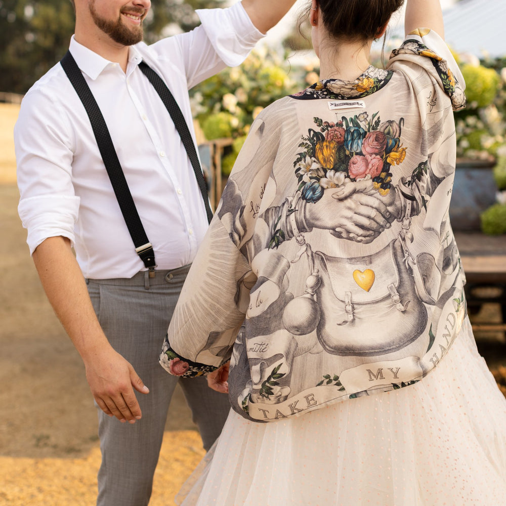 A joyful blend of 17th-century engravings, painted hearts, and hand-coloured florals on our cropped Take My Hand Pixie duster kimono – Market of Stars