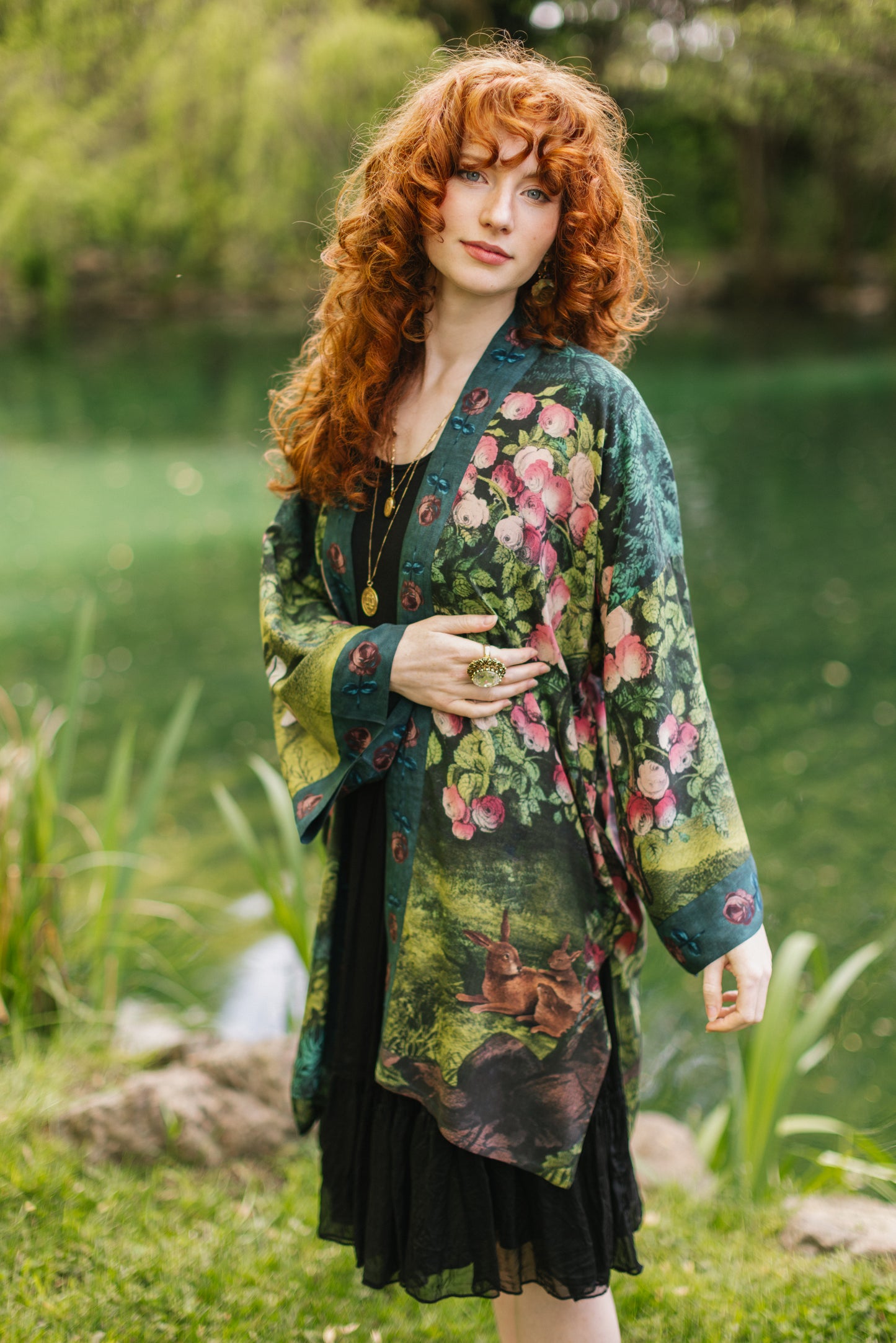 Model wearing a mid-length duster robe ft. hand-coloured etching from the 1880s called The Bower of Roses - Market of Stars