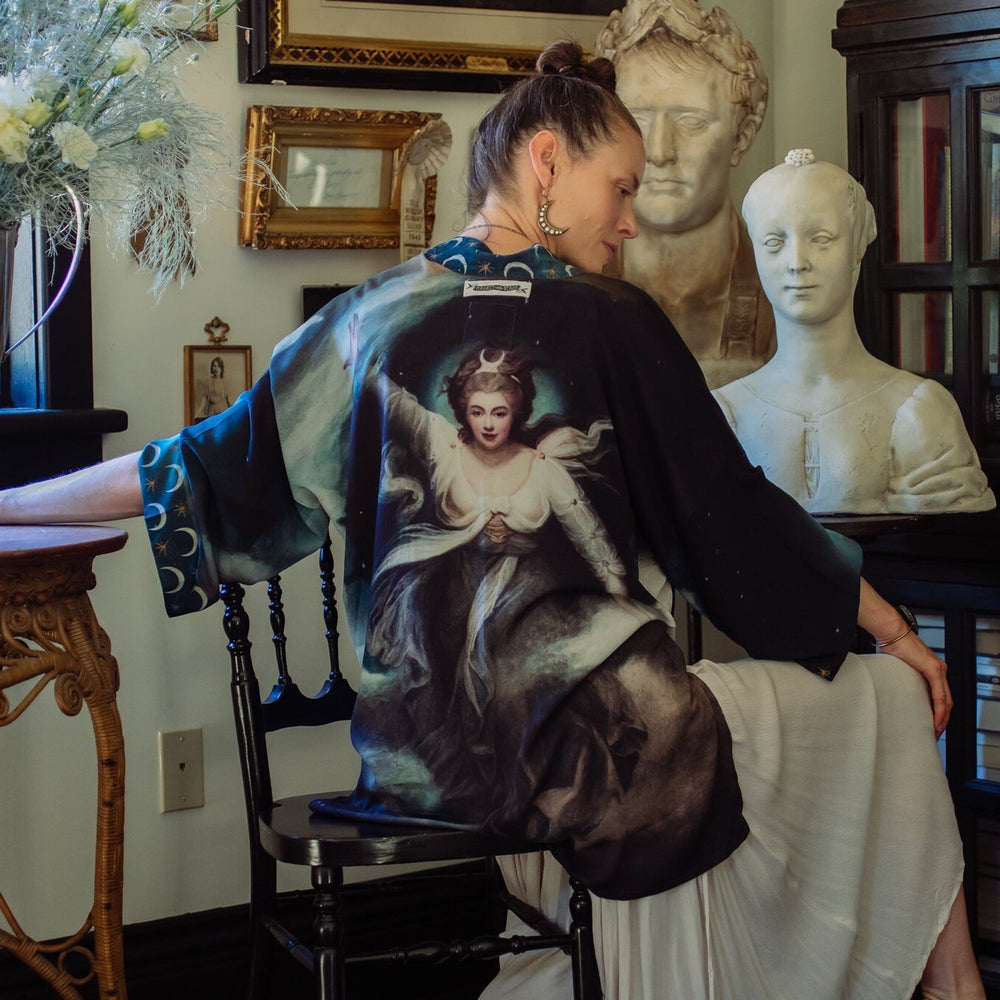 The Dreamer kimono jacket featuring a celestial Moon Goddess portrait with swirling sky detail and starry trim – Market of Stars