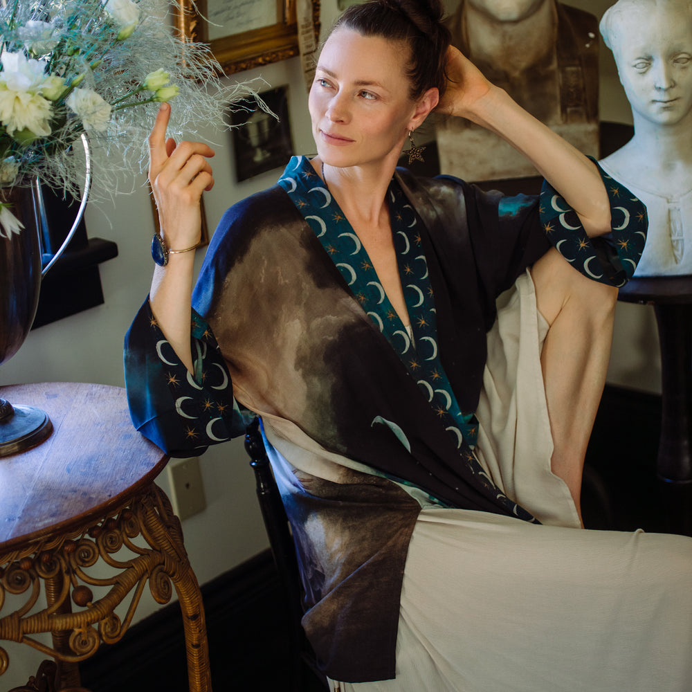 The Dreamer kimono jacket featuring a celestial Moon Goddess portrait with swirling sky detail and starry trim – Market of Stars
