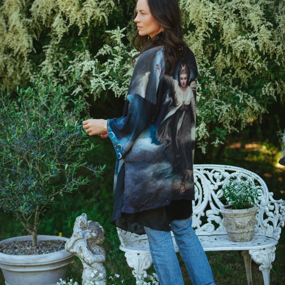 
                  
                    The Dreamer kimono jacket featuring a celestial Moon Goddess portrait with swirling sky detail and starry trim – Market of Stars
                  
                