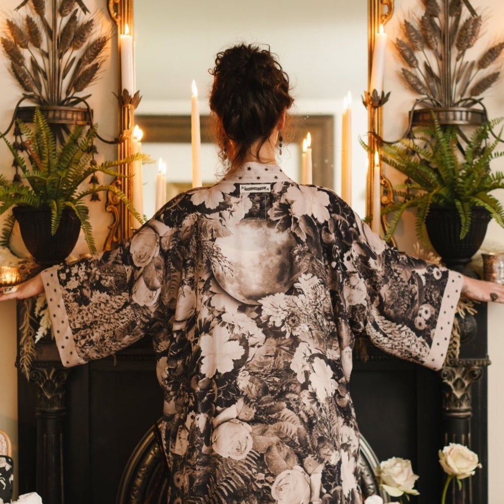 Model wearing Looking Glass Opera Robe featuring grown-up Alice Liddell, Victorian botanicals, and celestial star and moon accents inspired by Wonderland – Market of Stars.
