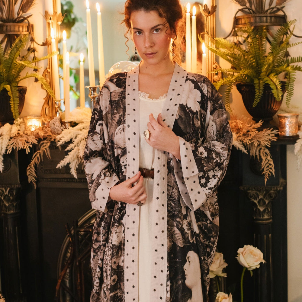 Model wearing Looking Glass Opera Robe featuring grown-up Alice Liddell, Victorian botanicals, and celestial star and moon accents inspired by Wonderland – Market of Stars.