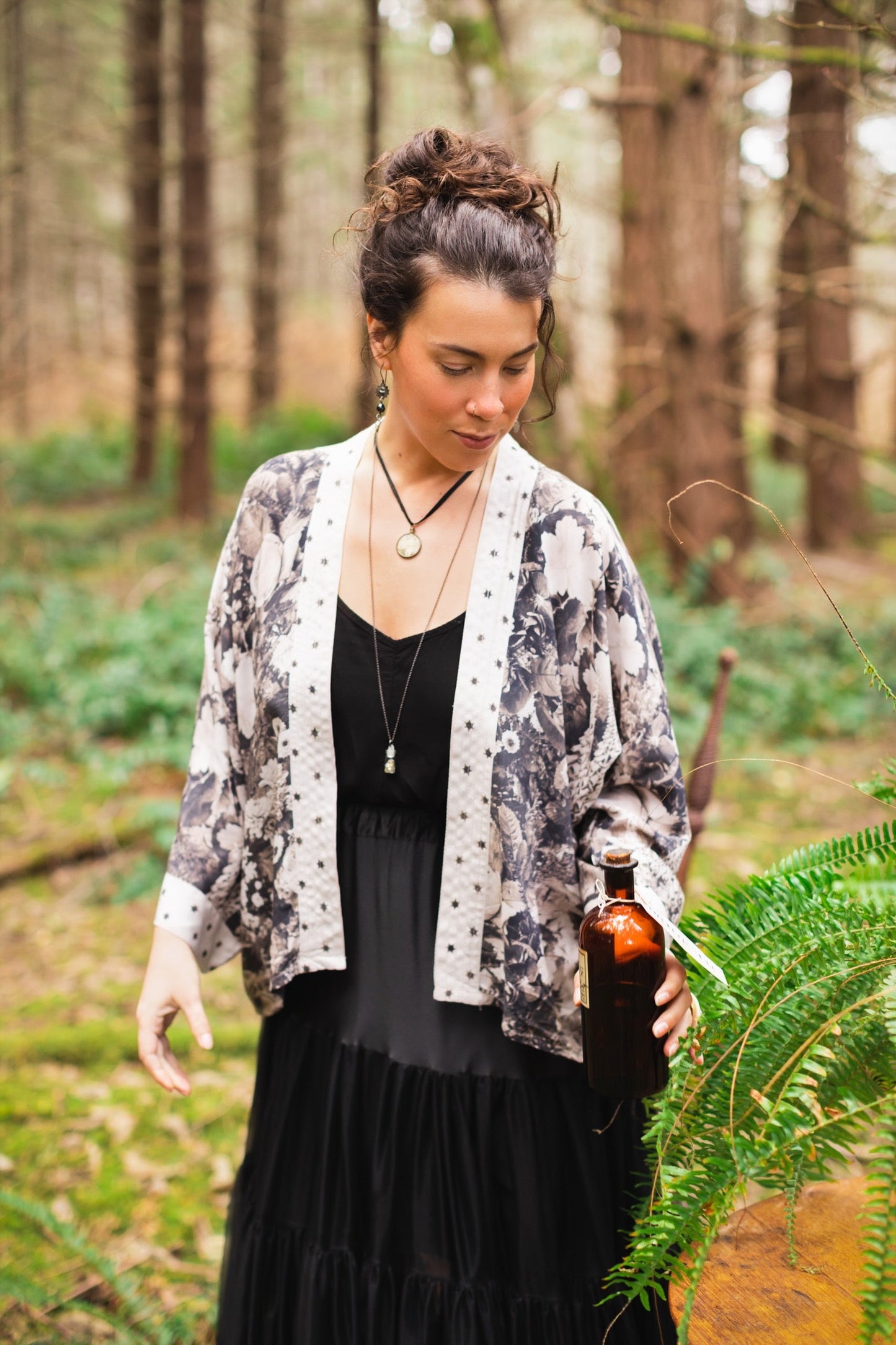 Model wearing Looking Glass Cropped Kimono featuring grown-up Alice Liddell, rare Victorian botanicals, and celestial star and moon accents inspired by Wonderland – Market of Stars.