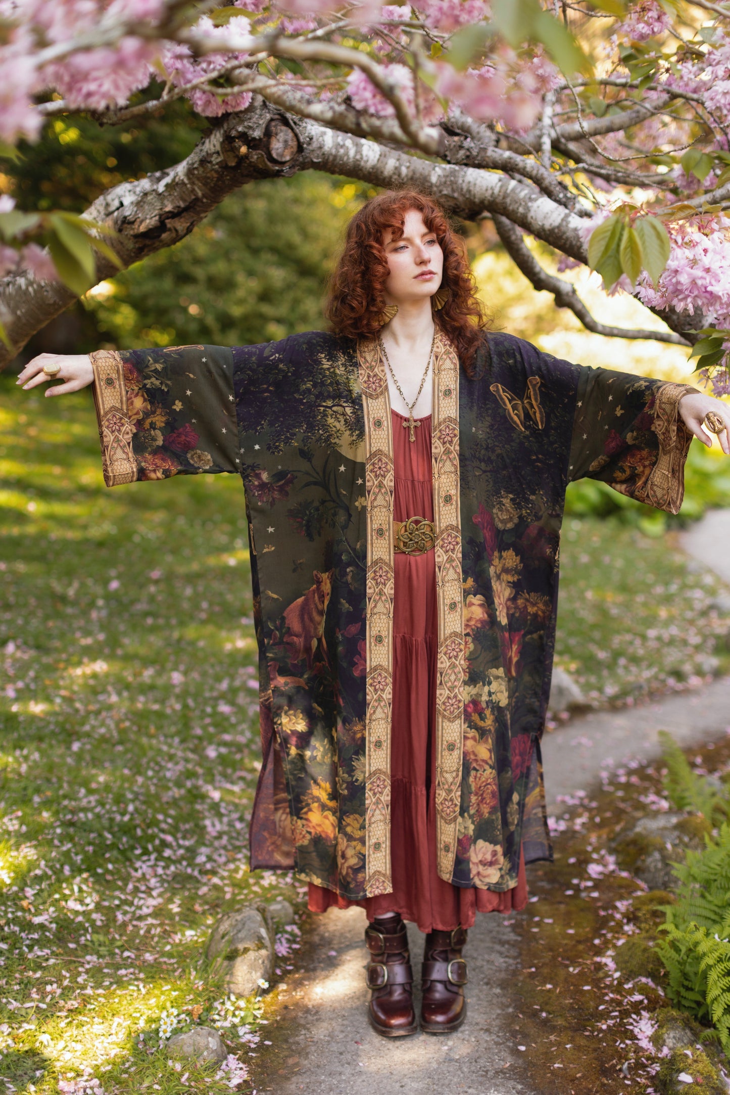 Model wearing a full-length bamboo-viscose duster featuring florals from centuries-old paintings and Rosetti’s iconic portrait of Joan of Arc - Market of Stars