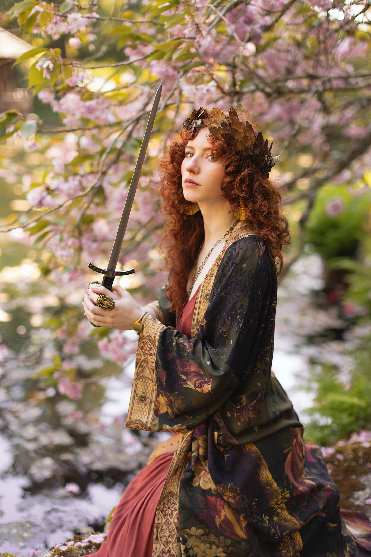 Model wearing a full-length bamboo-viscose duster featuring florals from centuries-old paintings and Rosetti’s iconic portrait of Joan of Arc - Market of Stars