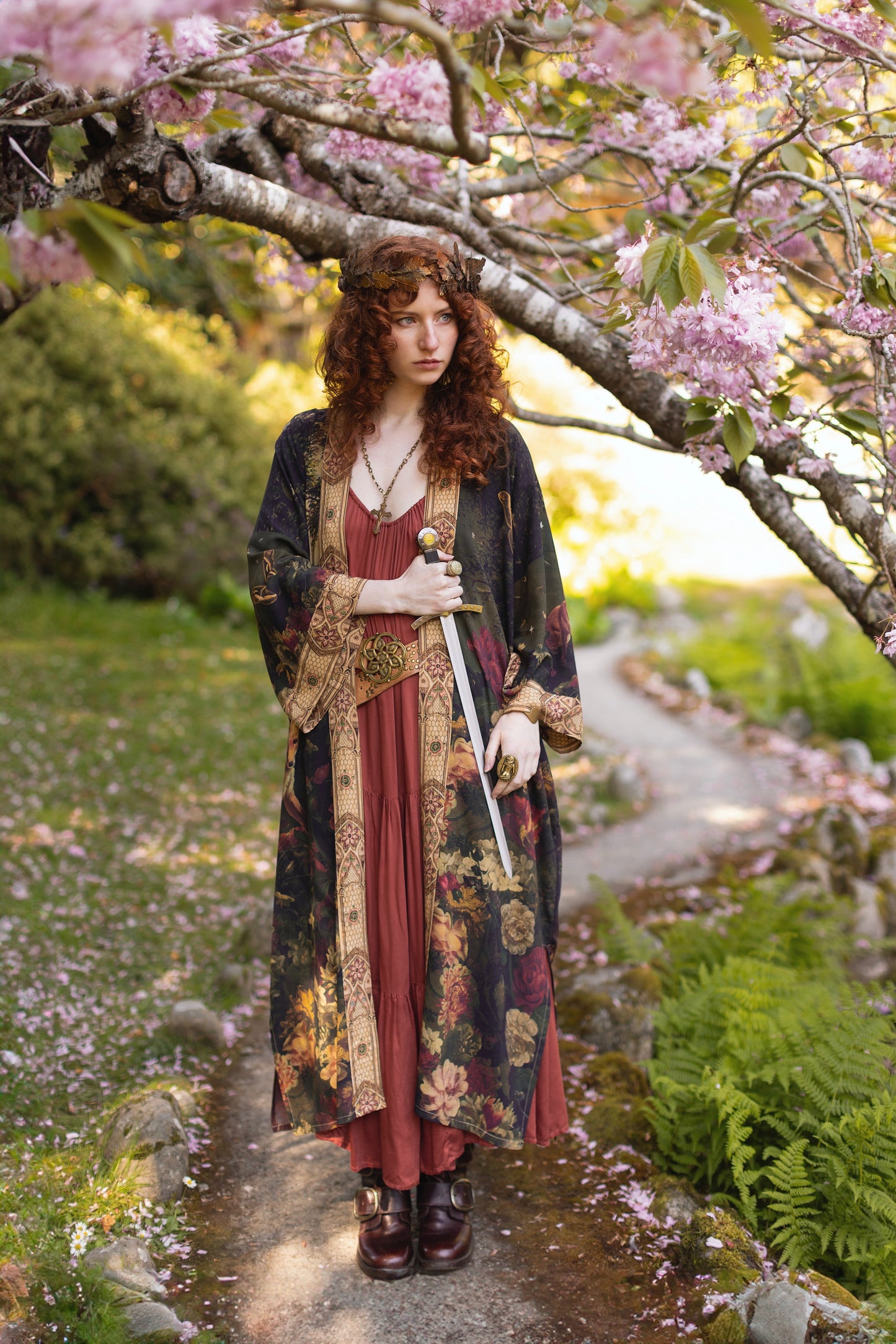 Model wearing a full-length bamboo-viscose duster featuring florals from centuries-old paintings and Rosetti’s iconic portrait of Joan of Arc - Market of Stars