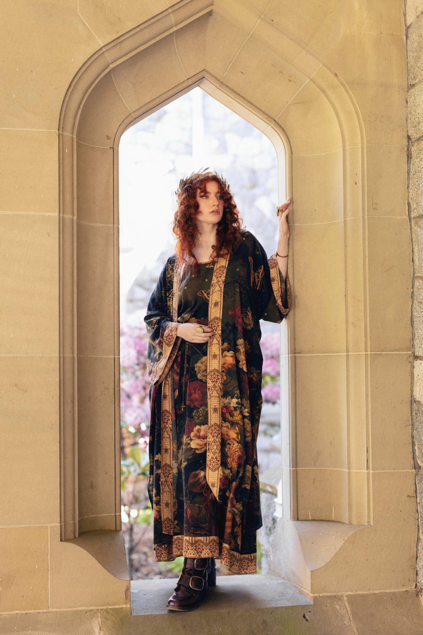 Model wearing a full-length bamboo-viscose duster featuring florals from centuries-old paintings and Rosetti’s iconic portrait of Joan of Arc - Market of Stars