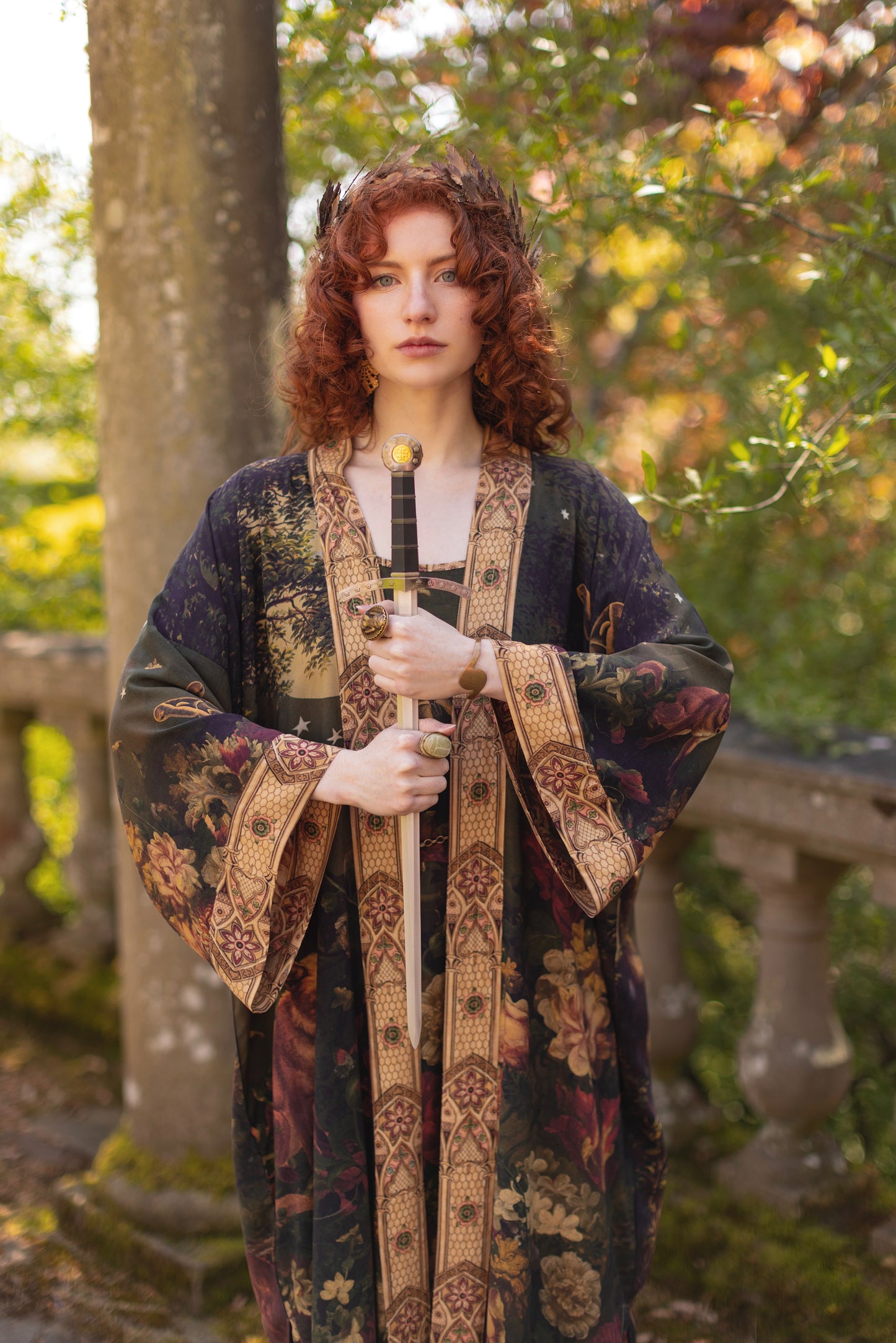 Model wearing a full-length bamboo-viscose duster featuring florals from centuries-old paintings and Rosetti’s iconic portrait of Joan of Arc - Market of Stars