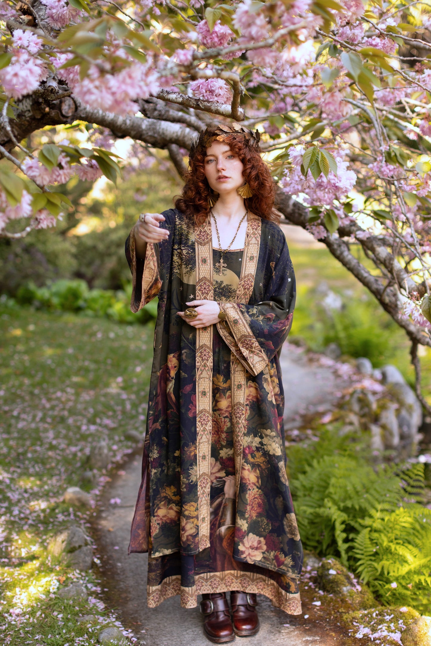 Model wearing a full-length bamboo-viscose duster featuring florals from centuries-old paintings and Rosetti’s iconic portrait of Joan of Arc - Market of Stars