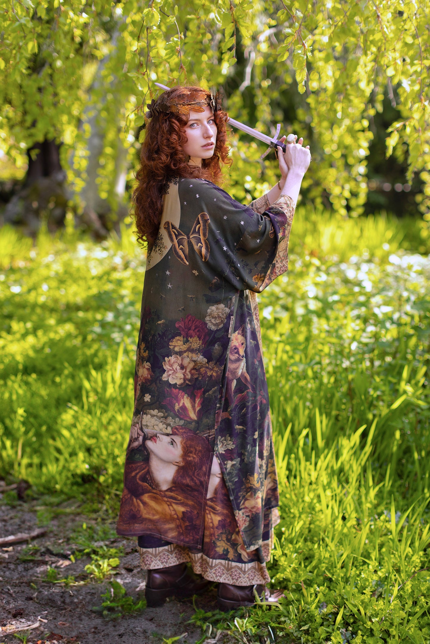 Model wearing a full-length bamboo-viscose duster featuring florals from centuries-old paintings and Rosetti’s iconic portrait of Joan of Arc - Market of Stars