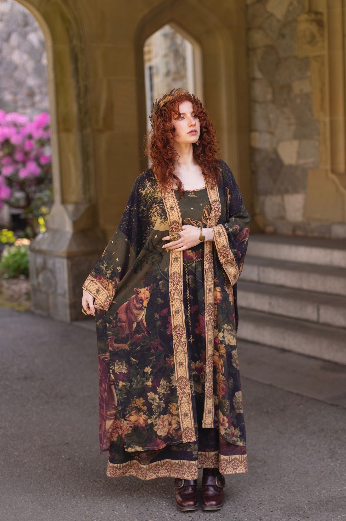 Model wearing a full-length bamboo-viscose duster featuring florals from centuries-old paintings and Rosetti’s iconic portrait of Joan of Arc - Market of Stars
