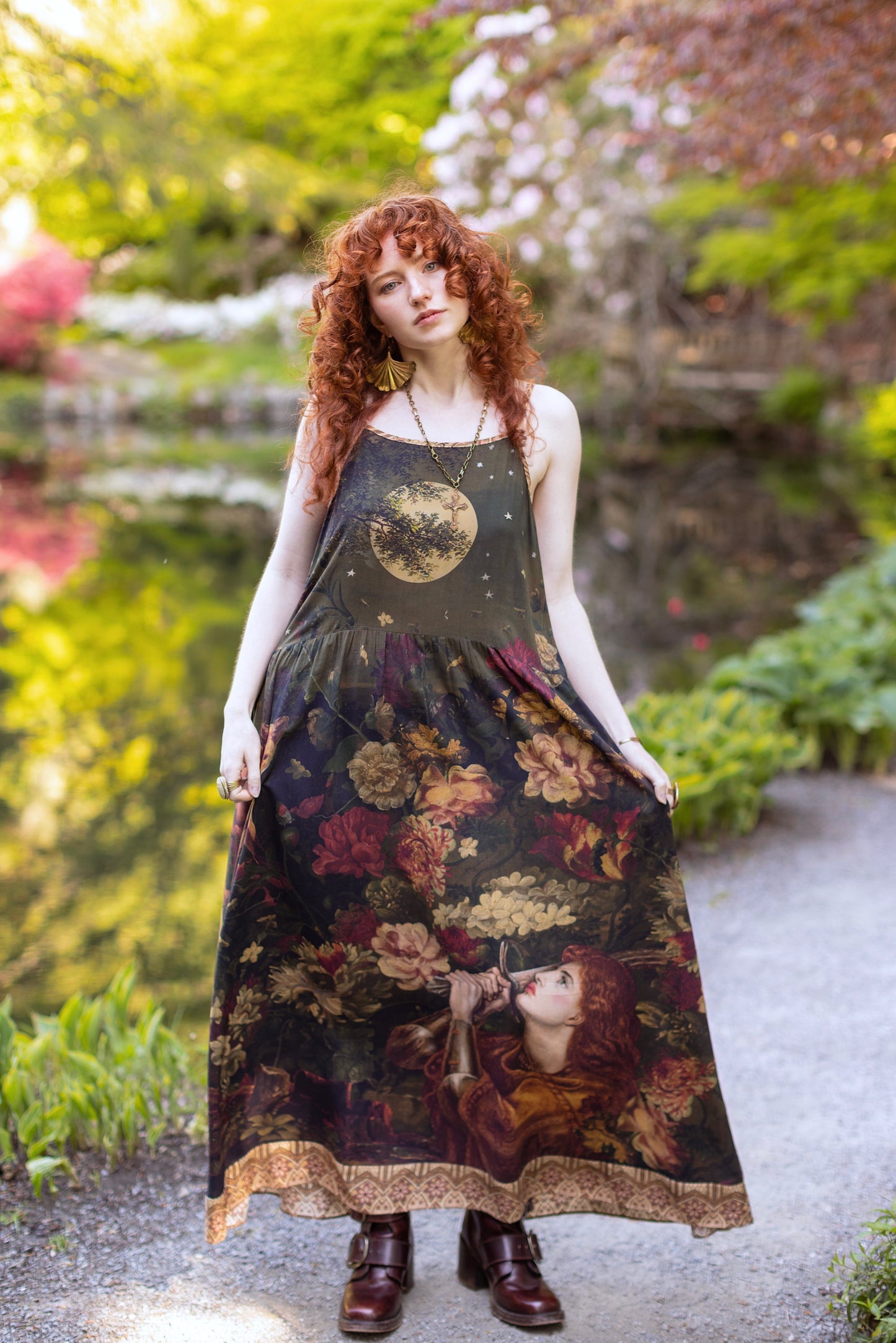 Model wearing a maxi-length bamboo-viscose slip dress featuring florals from centuries-old paintings and Rosetti’s iconic portrait of Joan of Arc - Market of Stars