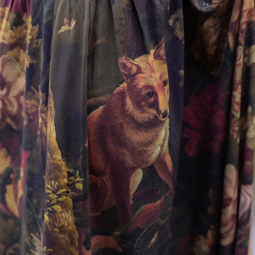 
                  
                    Model wearing a maxi-length bamboo-viscose slip dress featuring florals from centuries-old paintings and Rosetti’s iconic portrait of Joan of Arc - Market of Stars
                  
                