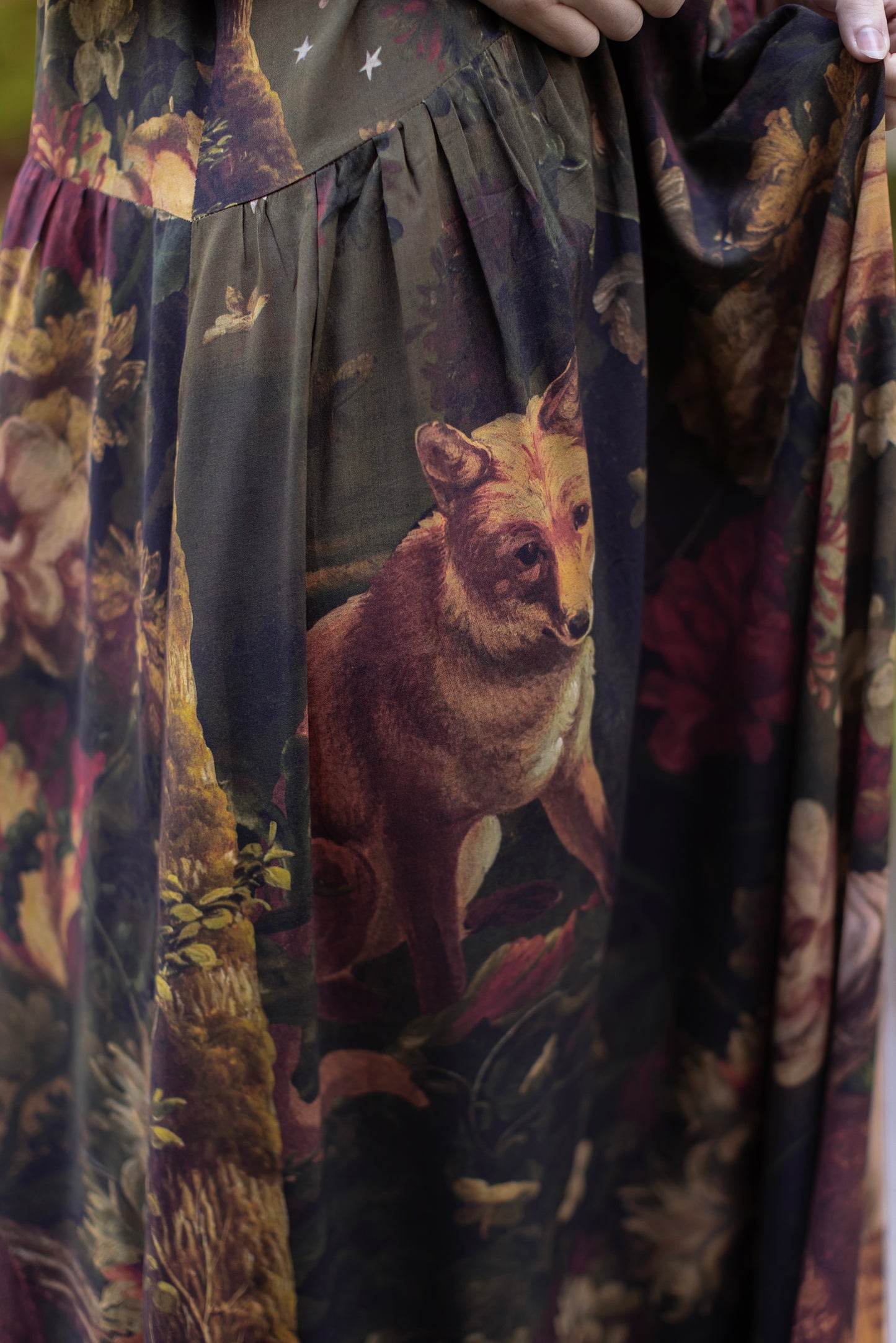 Model wearing a maxi-length bamboo-viscose slip dress featuring florals from centuries-old paintings and Rosetti’s iconic portrait of Joan of Arc - Market of Stars