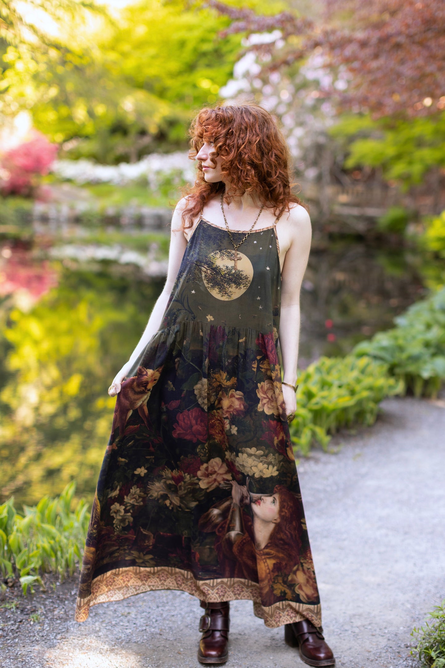 Model wearing a maxi-length bamboo-viscose slip dress featuring florals from centuries-old paintings and Rosetti’s iconic portrait of Joan of Arc - Market of Stars