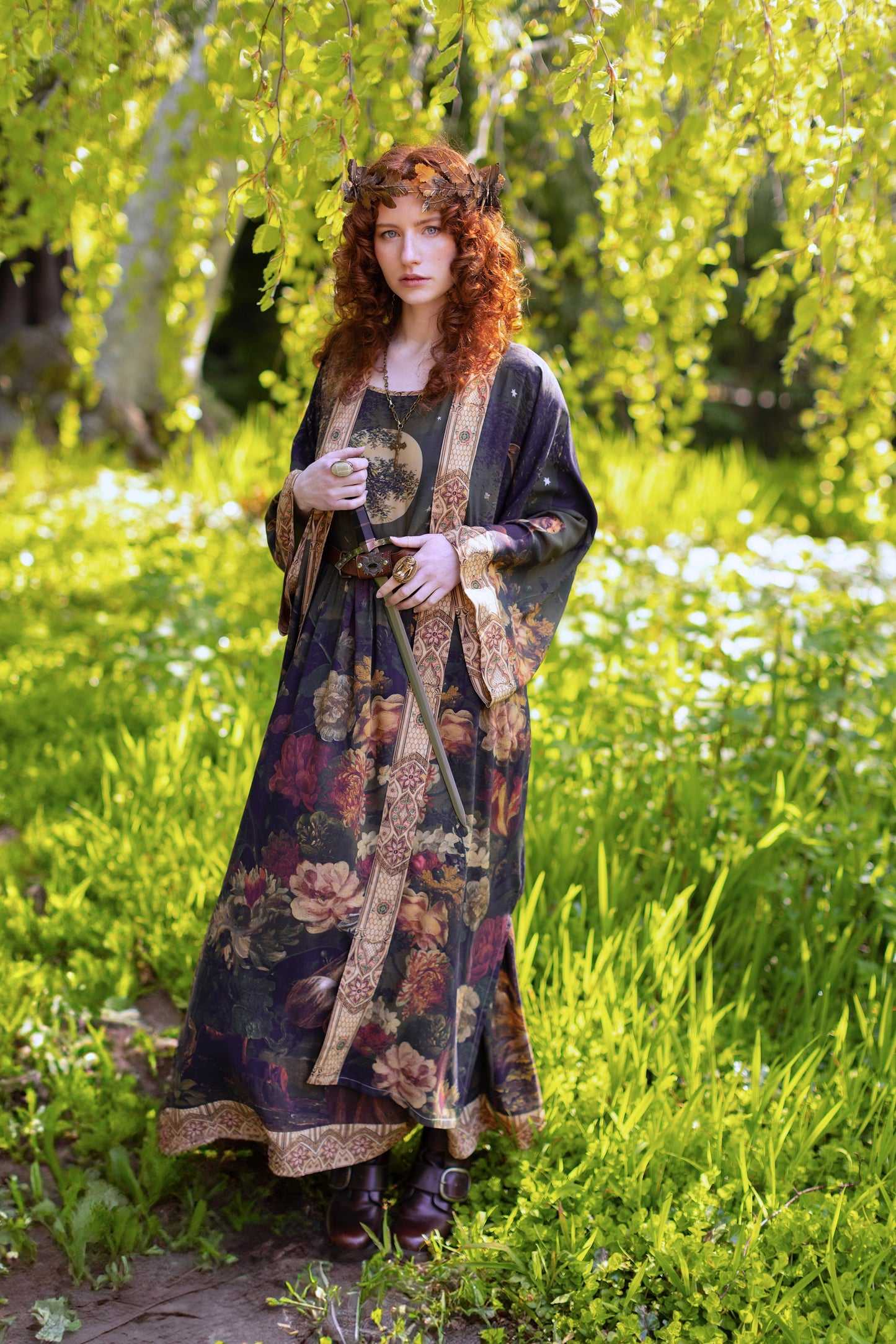 Model wearing a maxi-length bamboo-viscose slip dress featuring florals from centuries-old paintings and Rosetti’s iconic portrait of Joan of Arc - Market of Stars