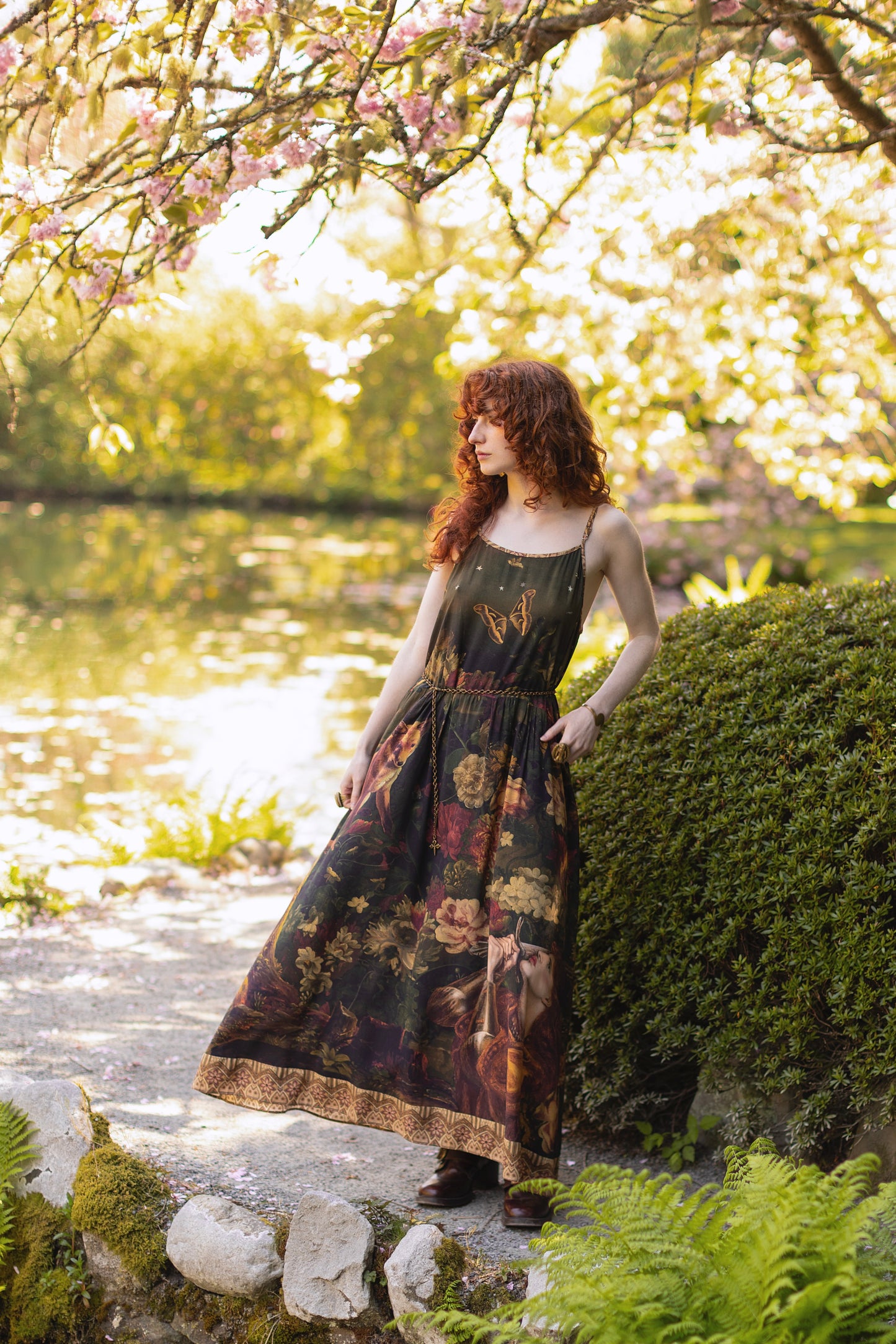 Model wearing a maxi-length bamboo-viscose slip dress featuring florals from centuries-old paintings and Rosetti’s iconic portrait of Joan of Arc - Market of Stars