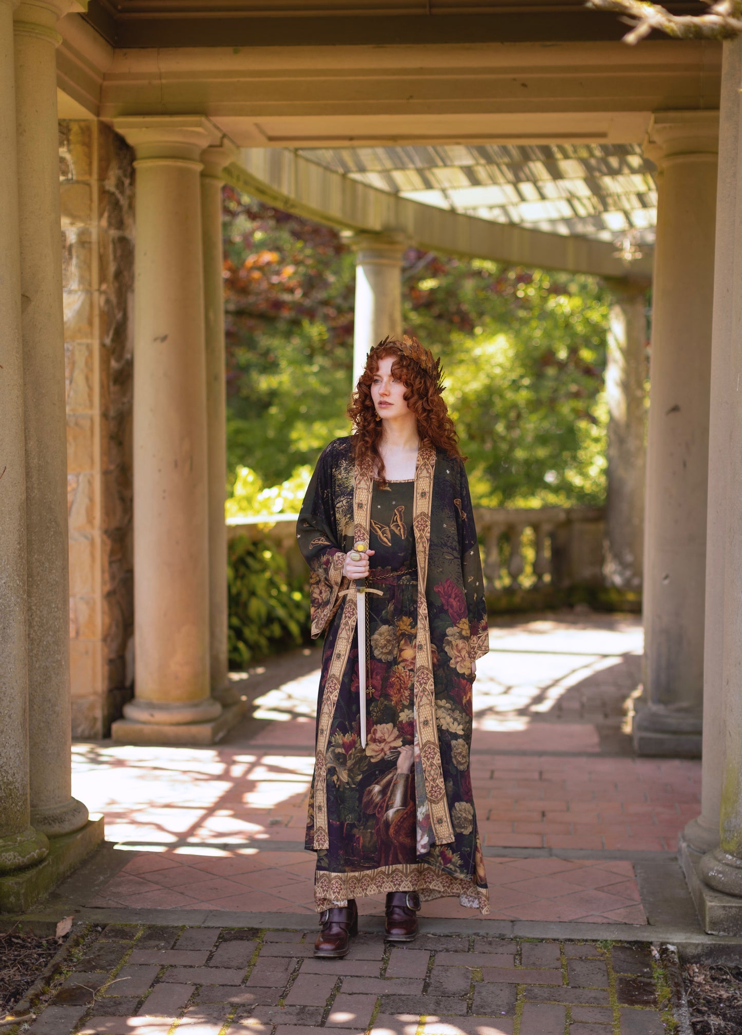Model wearing a maxi-length bamboo-viscose slip dress featuring florals from centuries-old paintings and Rosetti’s iconic portrait of Joan of Arc - Market of Stars