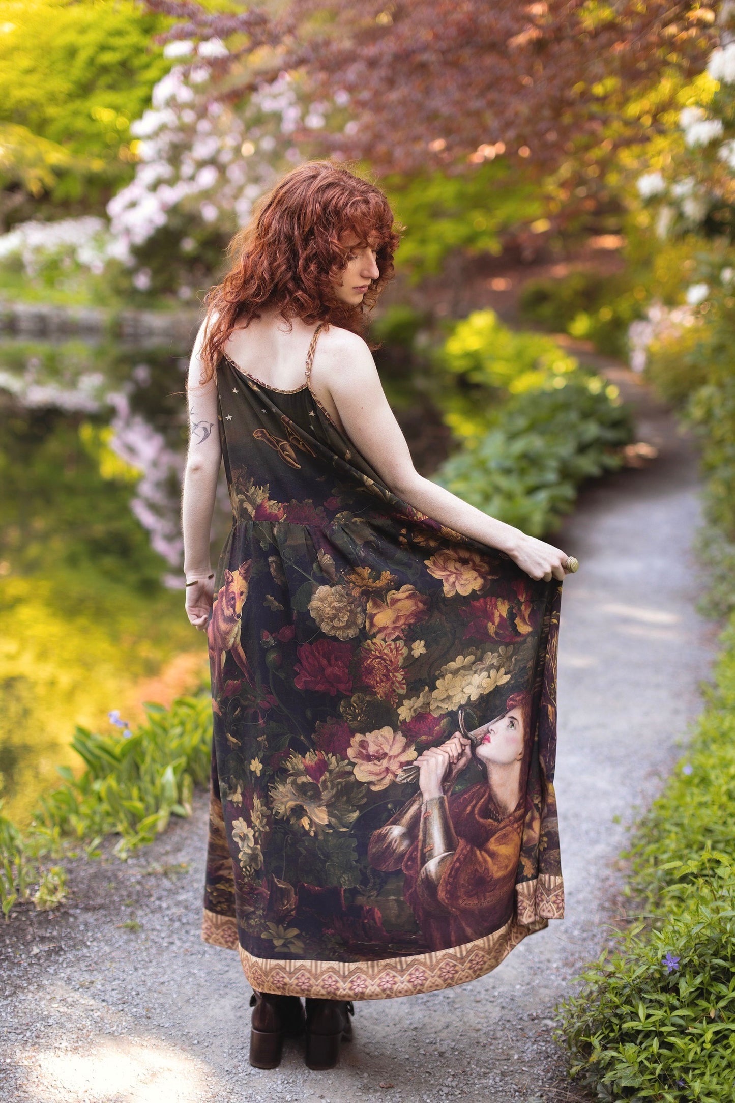 Model wearing a maxi-length bamboo-viscose slip dress featuring florals from centuries-old paintings and Rosetti’s iconic portrait of Joan of Arc - Market of Stars