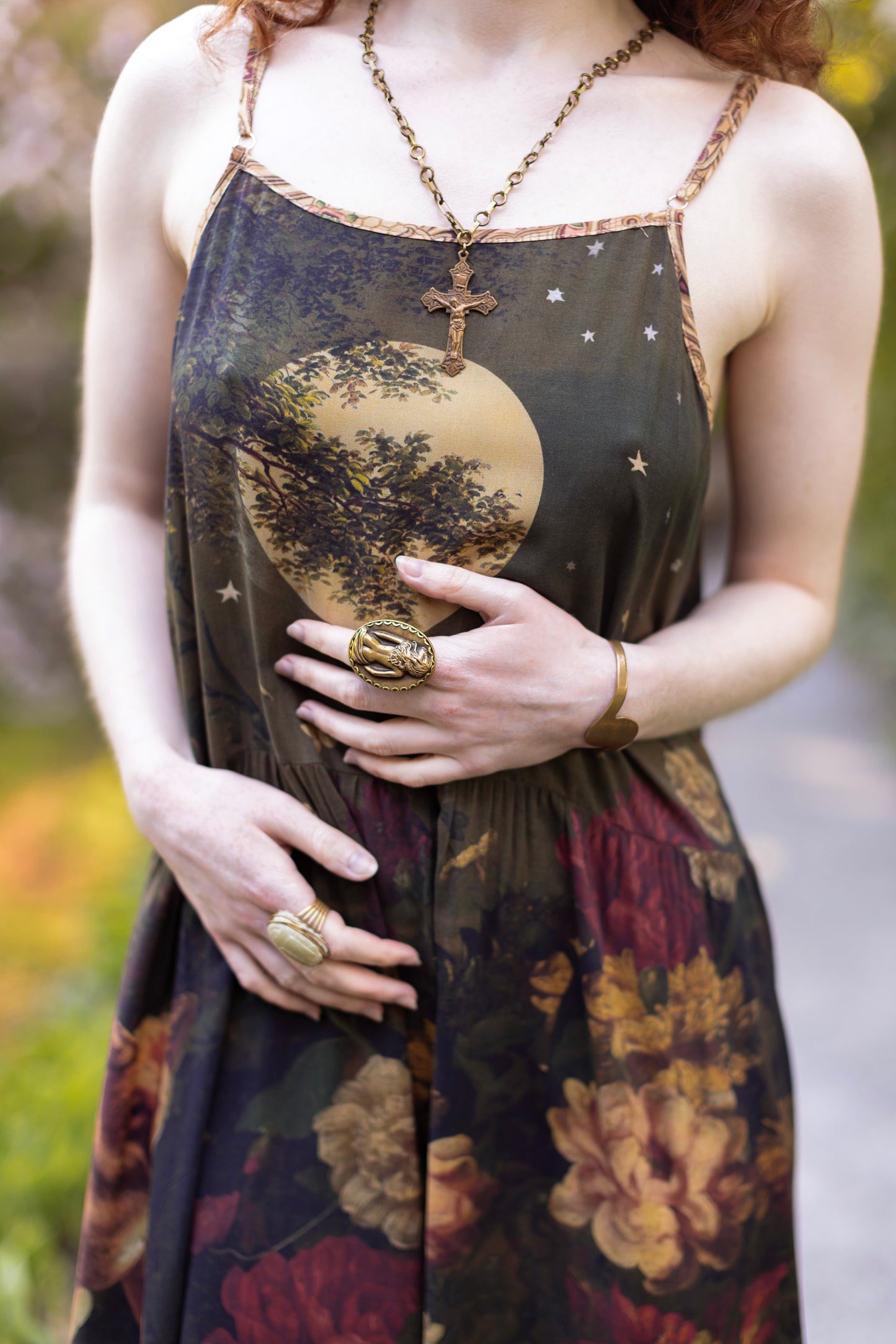 Model wearing a maxi-length bamboo-viscose slip dress featuring florals from centuries-old paintings and Rosetti’s iconic portrait of Joan of Arc - Market of Stars
