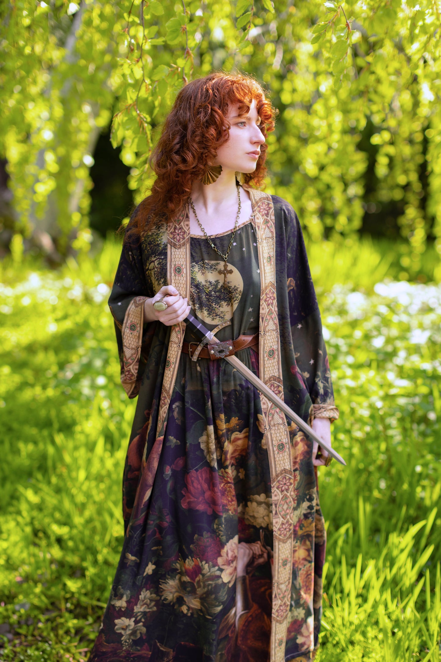 Model wearing a maxi-length bamboo-viscose slip dress featuring florals from centuries-old paintings and Rosetti’s iconic portrait of Joan of Arc - Market of Stars