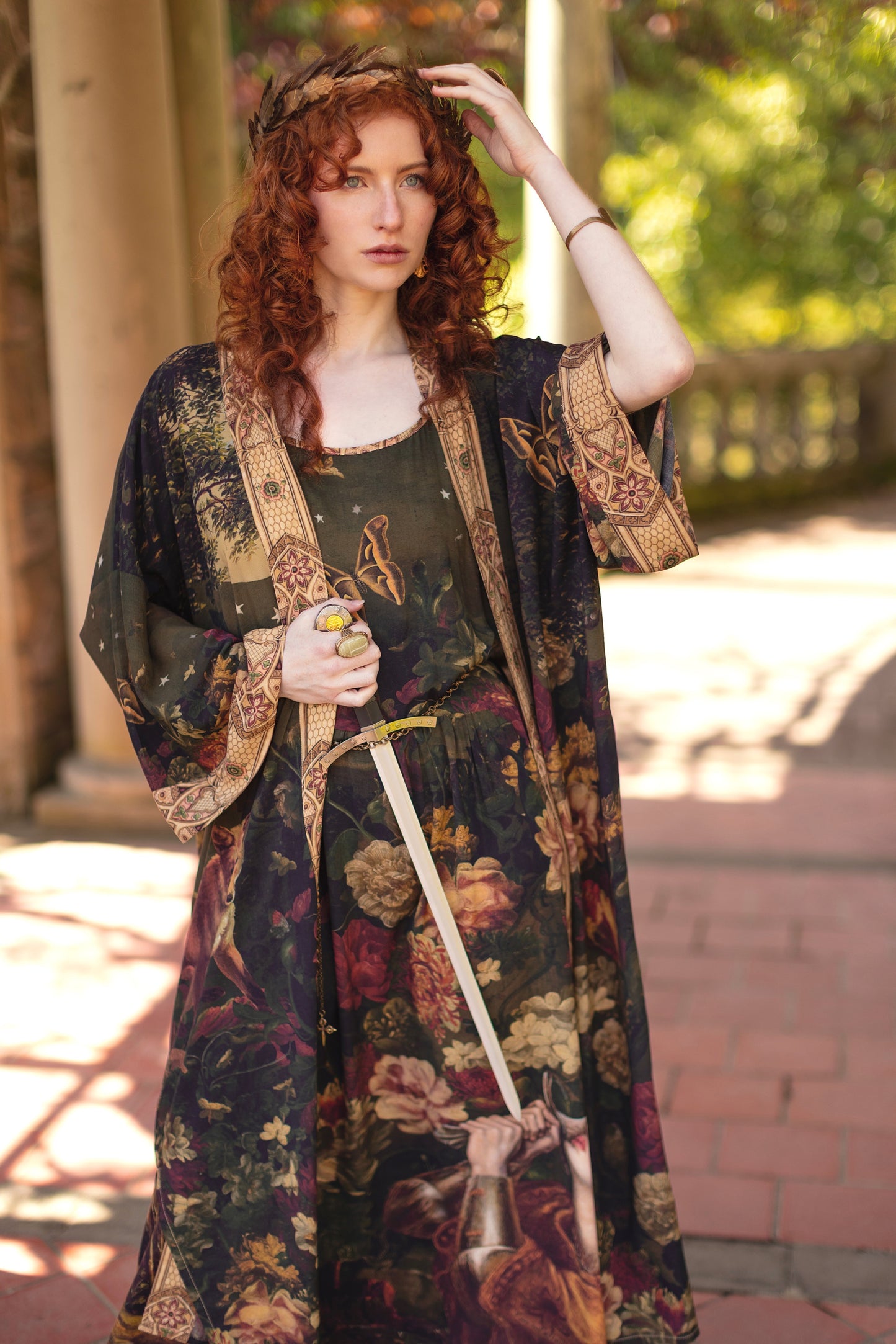 Model wearing a maxi-length bamboo-viscose slip dress featuring florals from centuries-old paintings and Rosetti’s iconic portrait of Joan of Arc - Market of Stars