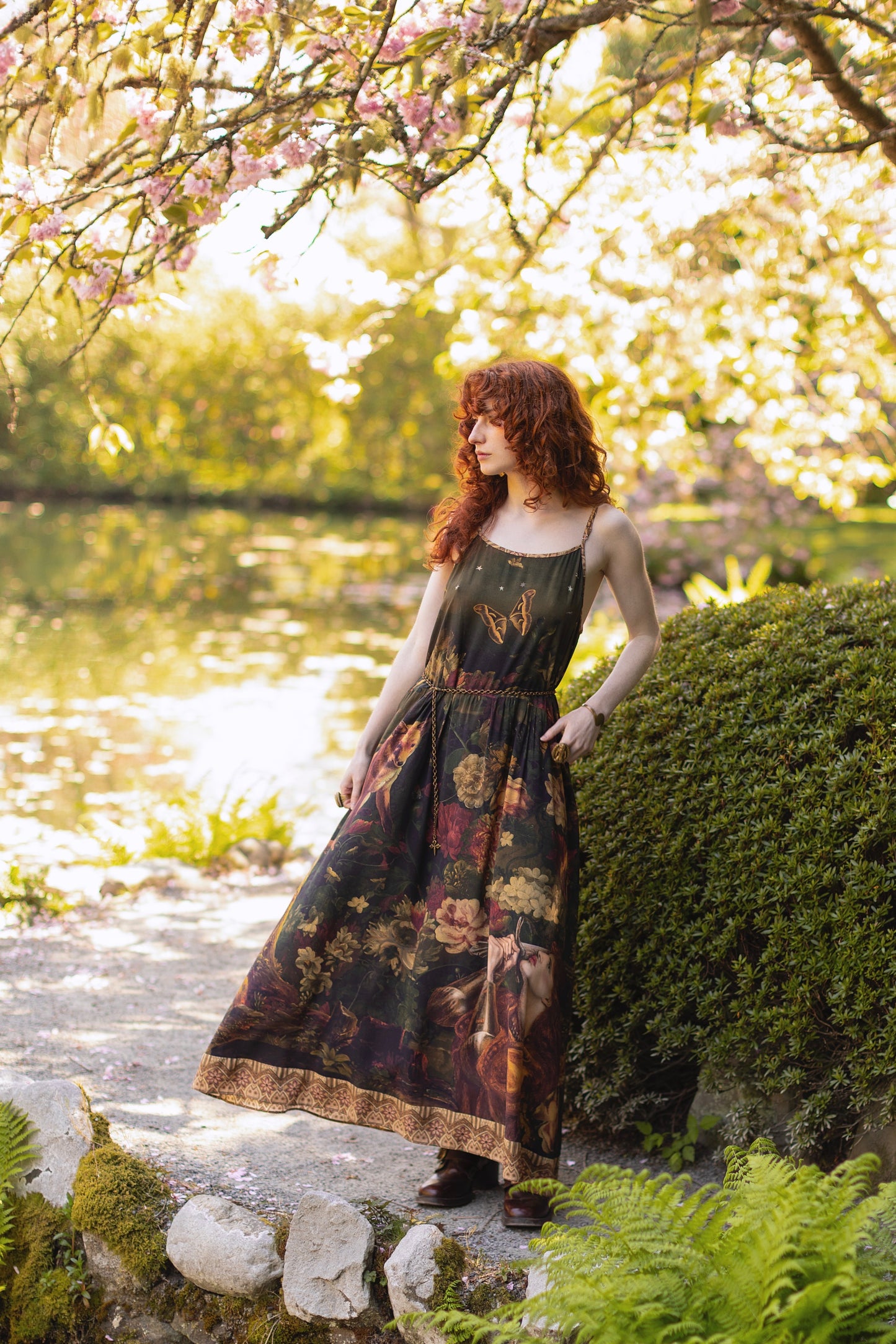 Model wearing a maxi-length bamboo-viscose slip dress featuring florals from centuries-old paintings and Rosetti’s iconic portrait of Joan of Arc - Market of Stars