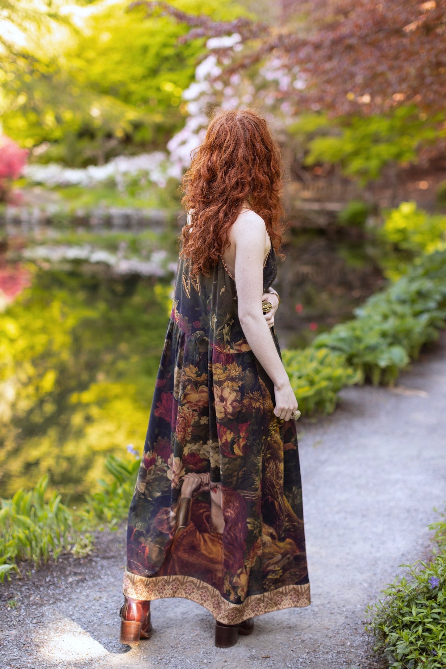 Model wearing a maxi-length bamboo-viscose slip dress featuring florals from centuries-old paintings and Rosetti’s iconic portrait of Joan of Arc - Market of Stars