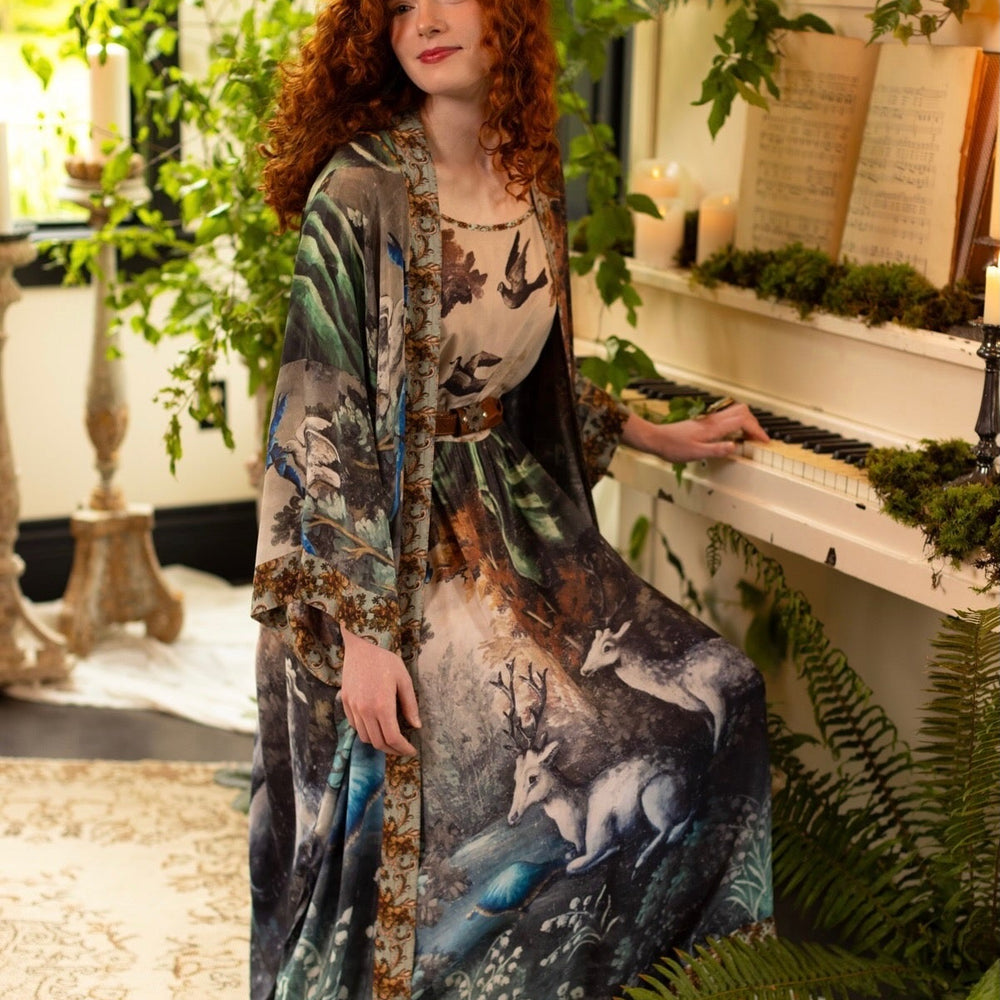 
                  
                    Model wearing our Theatre of Dreams Slip Dress featuring whimsical deer and birds from Jennifer Lanne’s romantic paintings – Market of Stars
                  
                