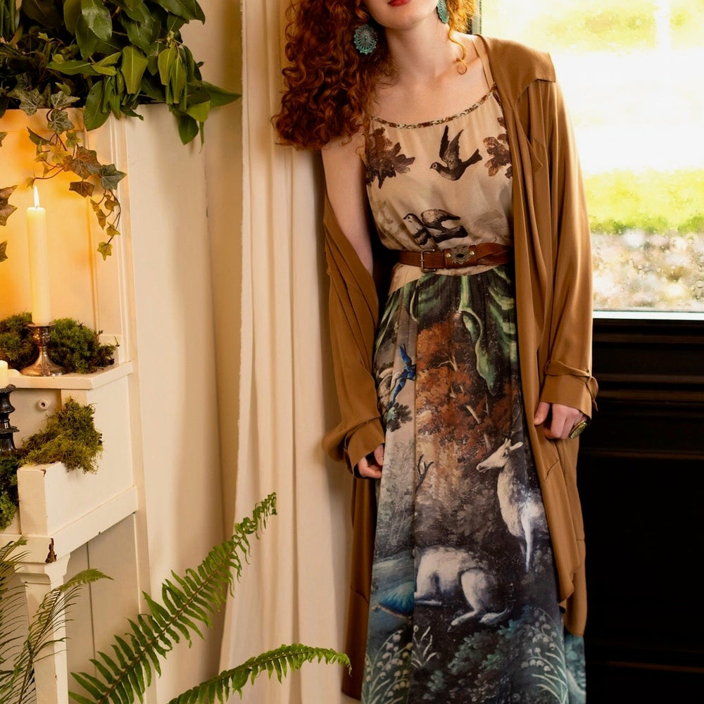 
                  
                    Model wearing our Theatre of Dreams Slip Dress featuring whimsical deer and birds from Jennifer Lanne’s romantic paintings – Market of Stars
                  
                