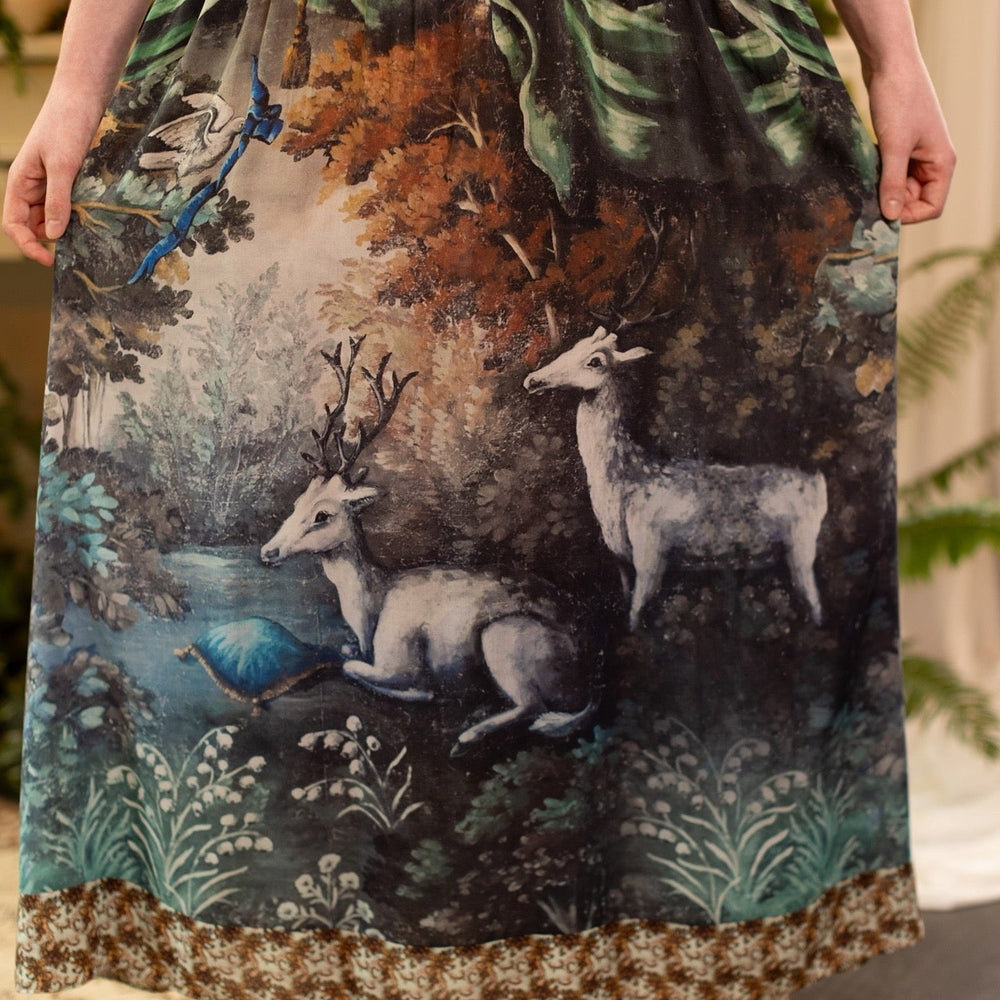 
                  
                    Model wearing our Theatre of Dreams Slip Dress featuring whimsical deer and birds from Jennifer Lanne’s romantic paintings – Market of Stars
                  
                
