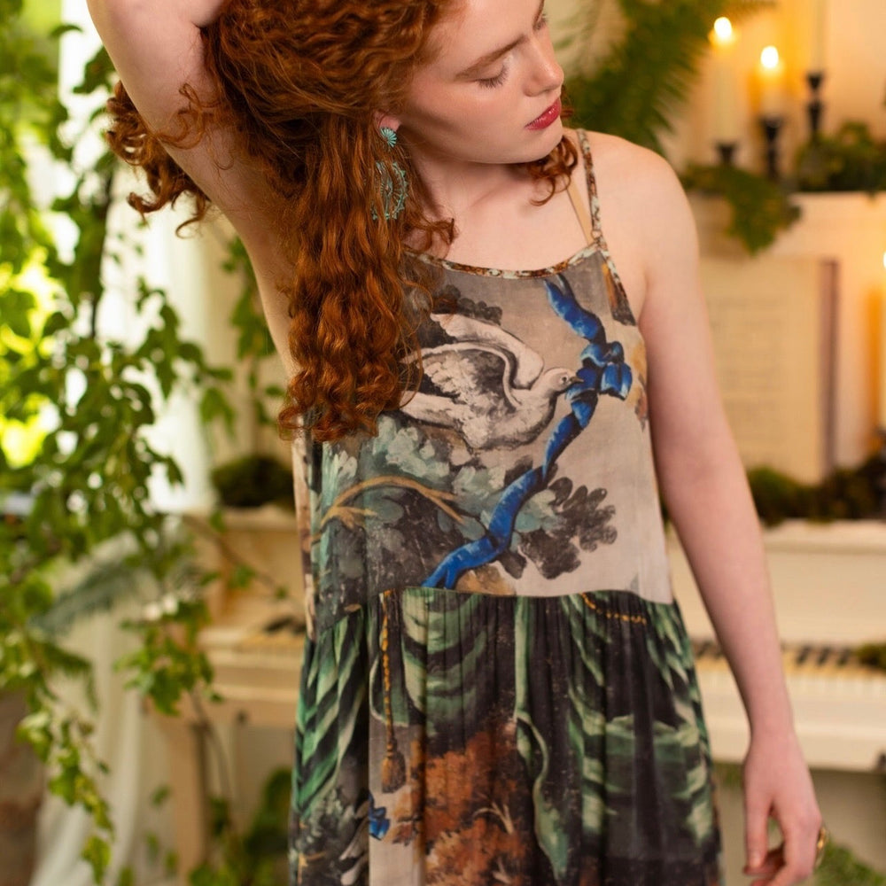 
                  
                    Model wearing our Theatre of Dreams Slip Dress featuring whimsical deer and birds from Jennifer Lanne’s romantic paintings – Market of Stars
                  
                