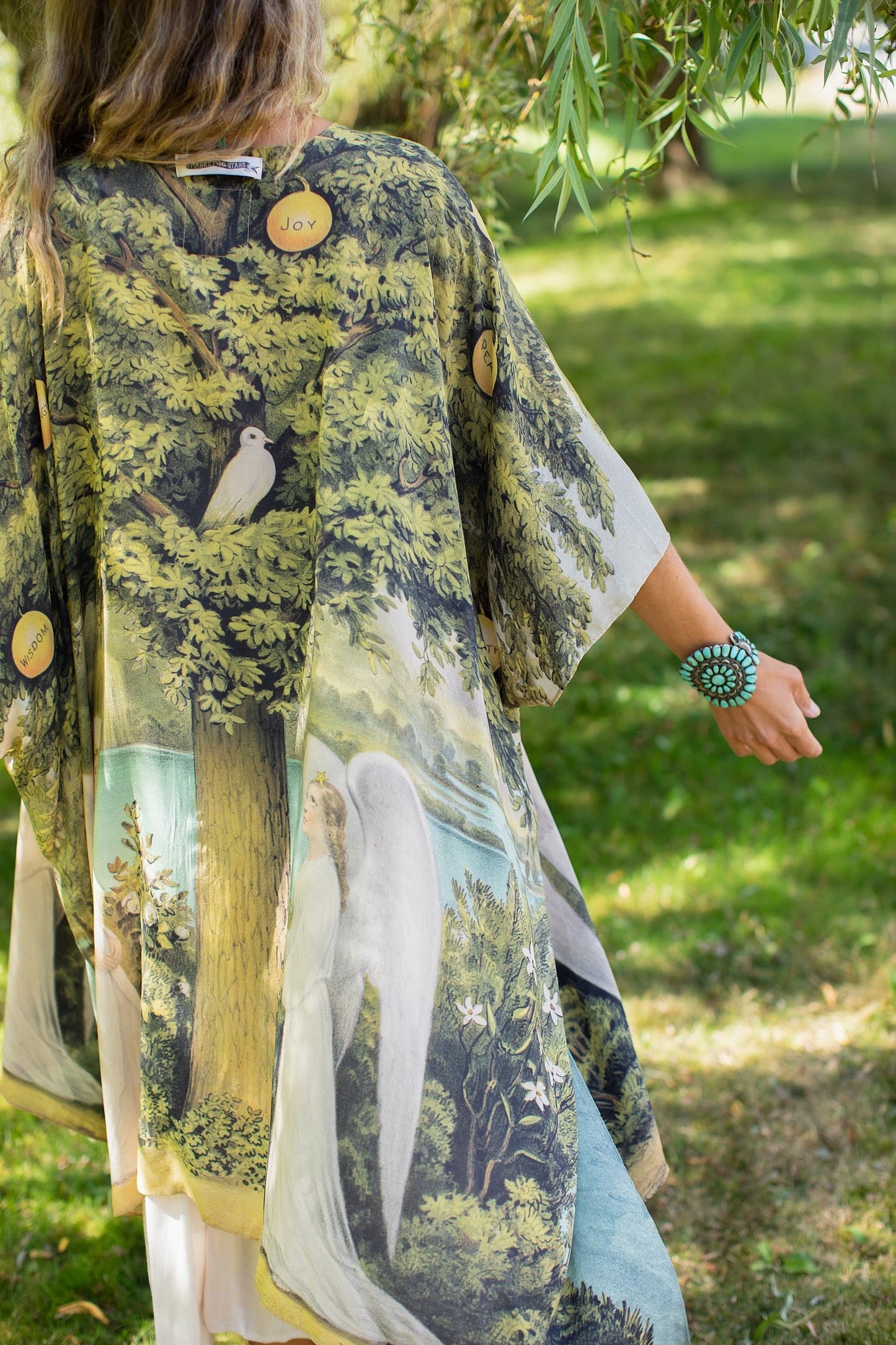Model wearing Tree of Life Starduster celebrating growth renewal and timeless beauty – Market of Stars