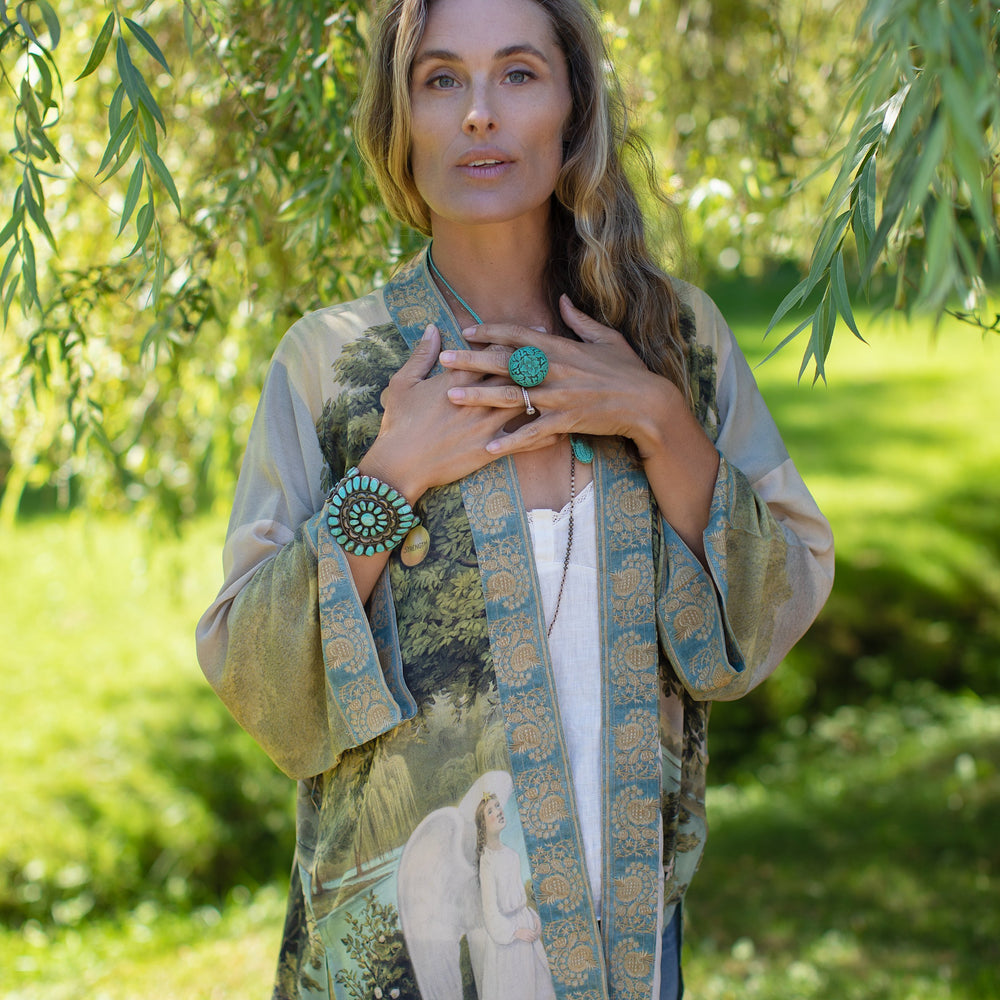 Model wearing Tree of Life Matinée Duster in aquas and verdant greens inspired by antique textiles – Market of Stars