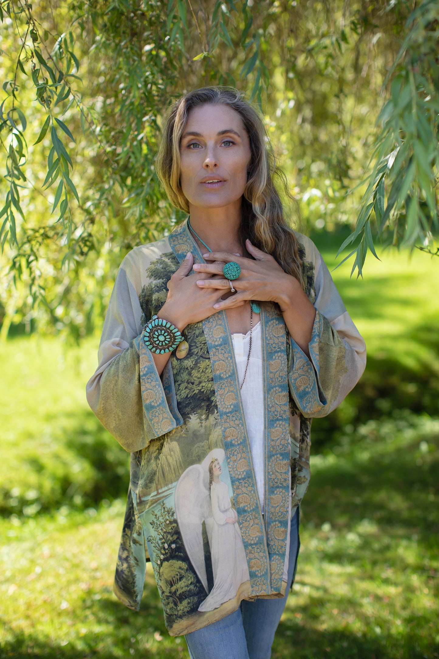 Model wearing Tree of Life Matinée Duster in aquas and verdant greens inspired by antique textiles – Market of Stars