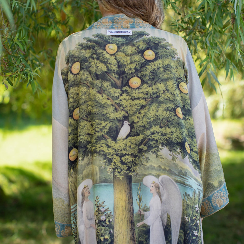 Model wearing Tree of Life Matinée Duster in aquas and verdant greens inspired by antique textiles – Market of Stars