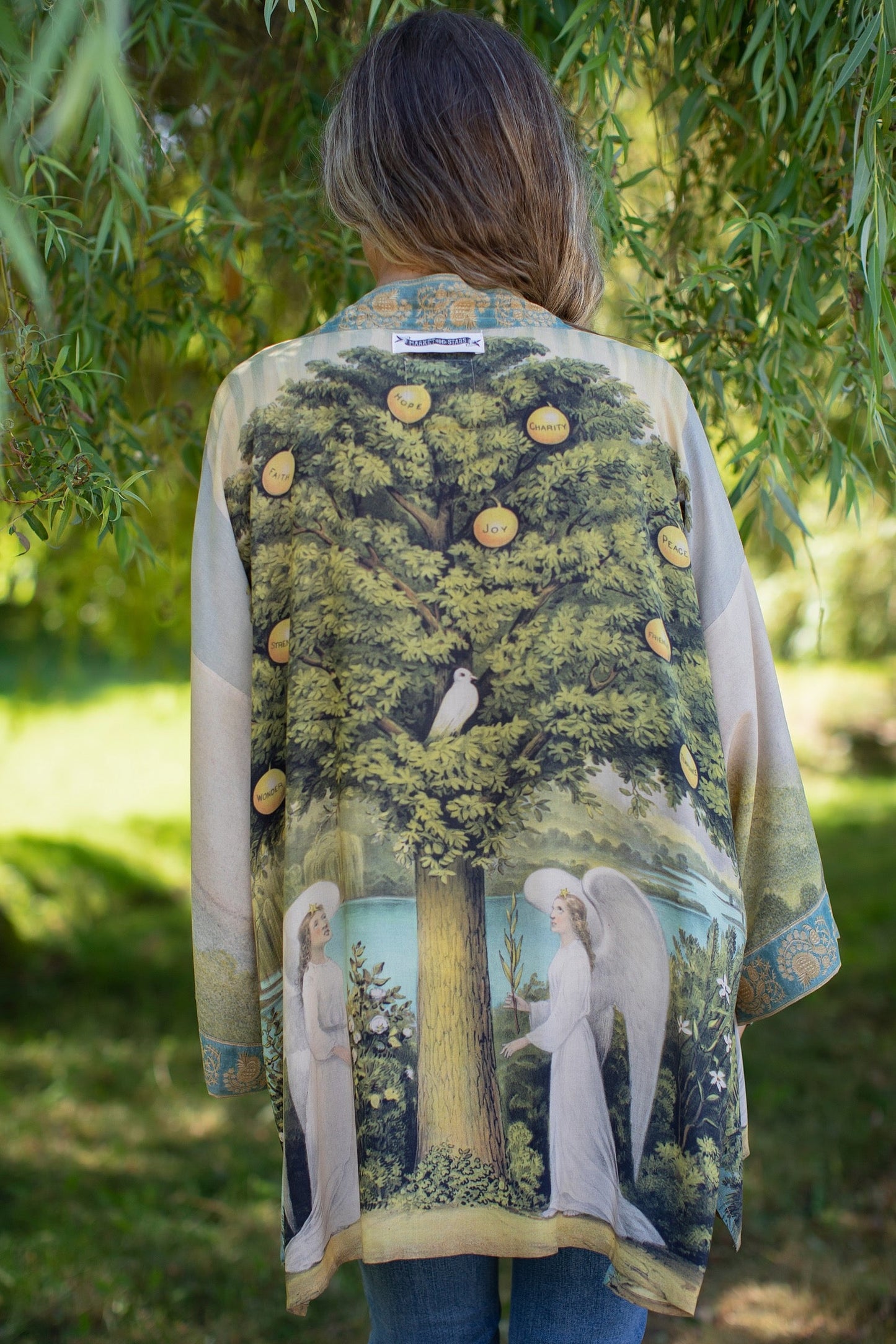 Model wearing Tree of Life Matinée Duster in aquas and verdant greens inspired by antique textiles – Market of Stars