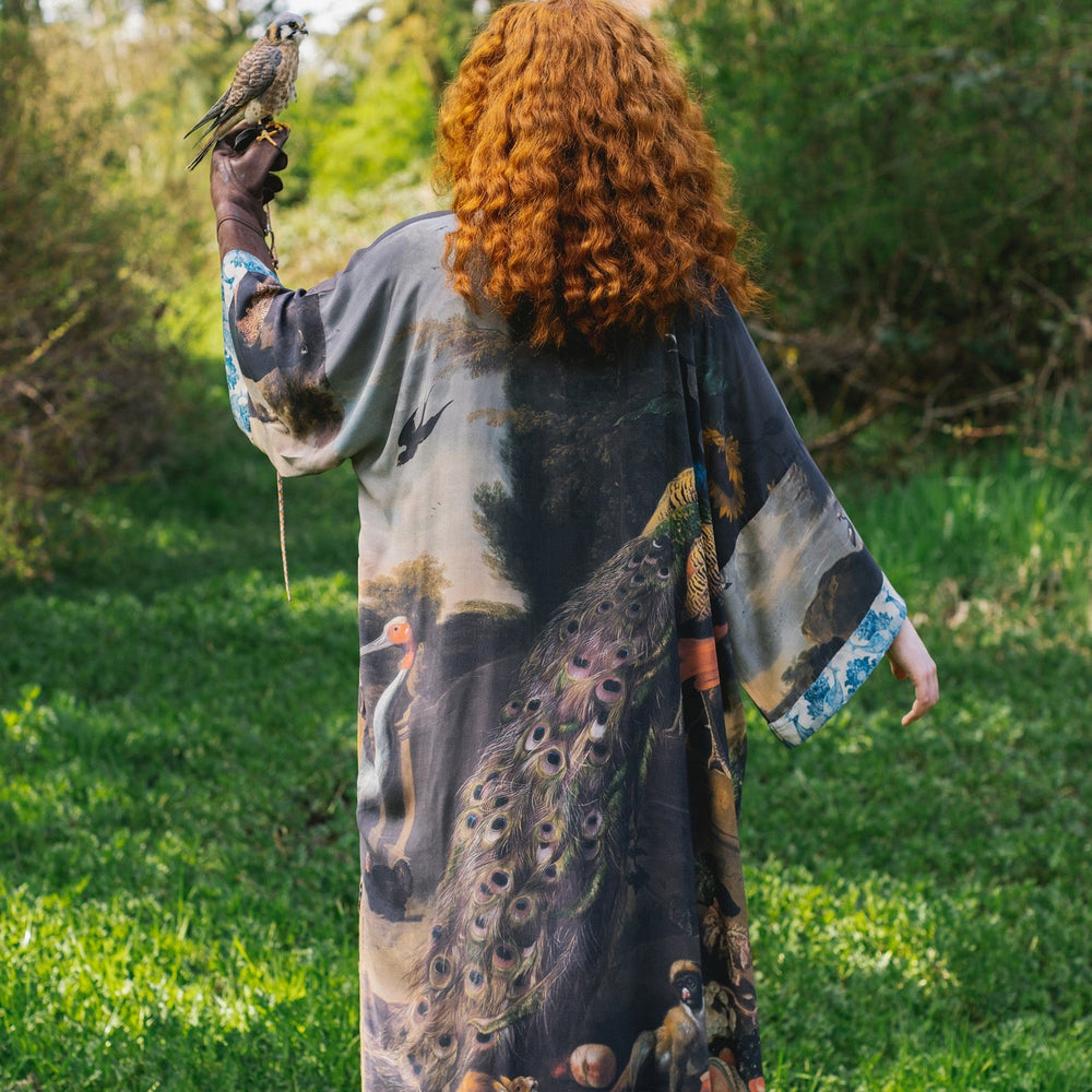 
                  
                    Model wearing Wild Beauty Opera Duster with antique lush florals and peacock – Market of Stars
                  
                