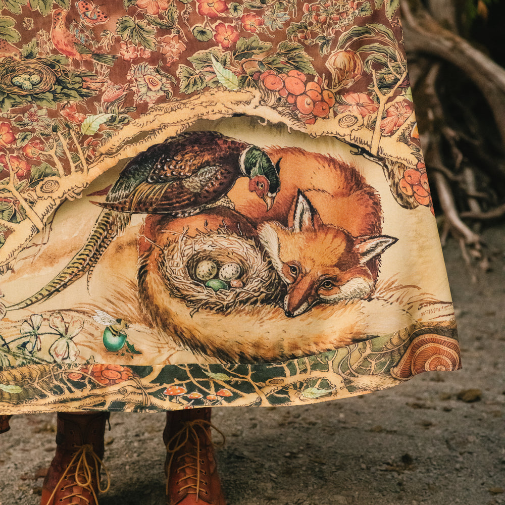 
                  
                    Model wearing a bamboo-viscose maxi length slip dress where even the unlikeliest of friends...a fox and a pheasant...find warmth in each other’s company. Created in collaboration with Charles van Sandwyck - Market of Stars
                  
                