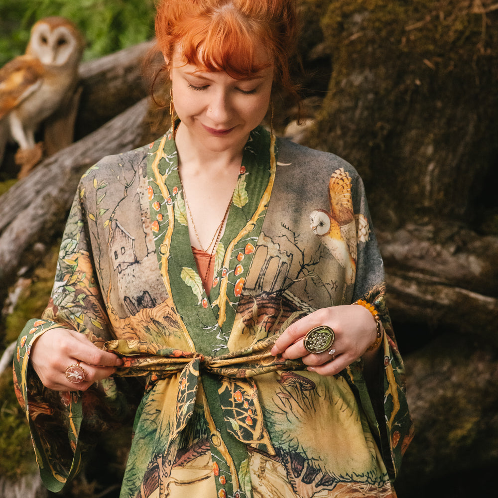 
                  
                    Model wearing a bamboo-viscose mid-length duster kimono robe where even the unlikeliest of friends...a fox and a pheasant...find warmth in each other’s company. Created in collaboration with Charles van Sandwyck - Market of Stars
                  
                