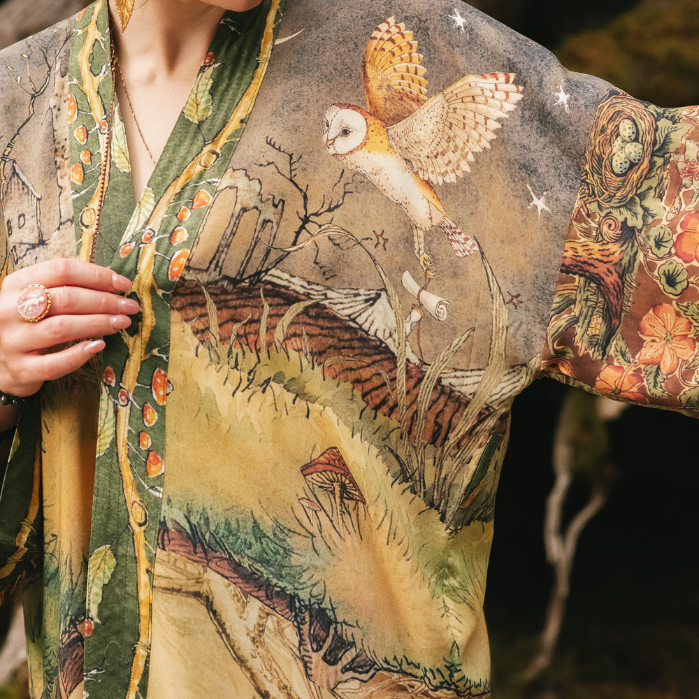 
                  
                    Model wearing a bamboo-viscose mid-length duster kimono robe where even the unlikeliest of friends...a fox and a pheasant...find warmth in each other’s company. Created in collaboration with Charles van Sandwyck - Market of Stars
                  
                