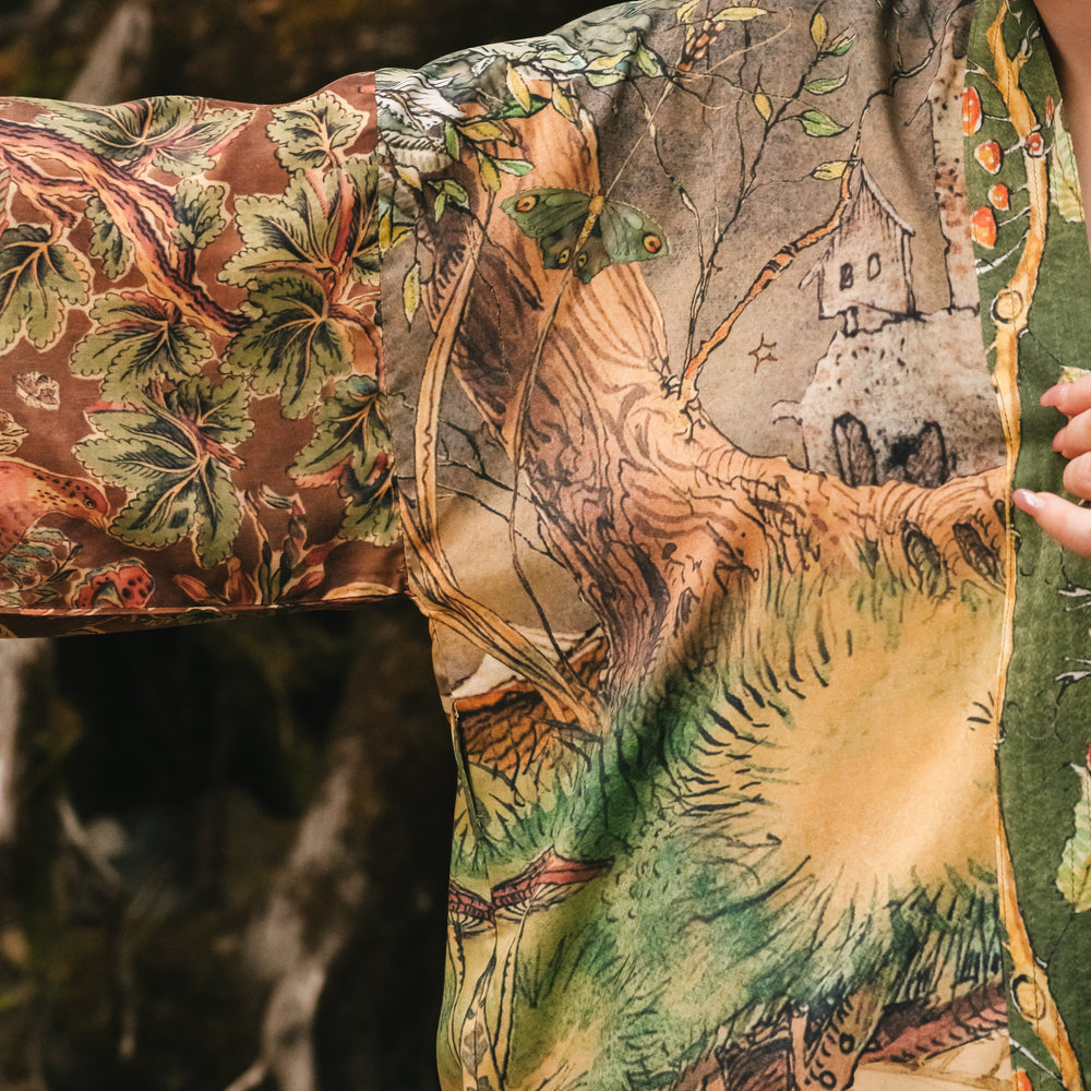 
                  
                    Model wearing a bamboo-viscose mid-length duster kimono robe where even the unlikeliest of friends...a fox and a pheasant...find warmth in each other’s company. Created in collaboration with Charles van Sandwyck - Market of Stars
                  
                